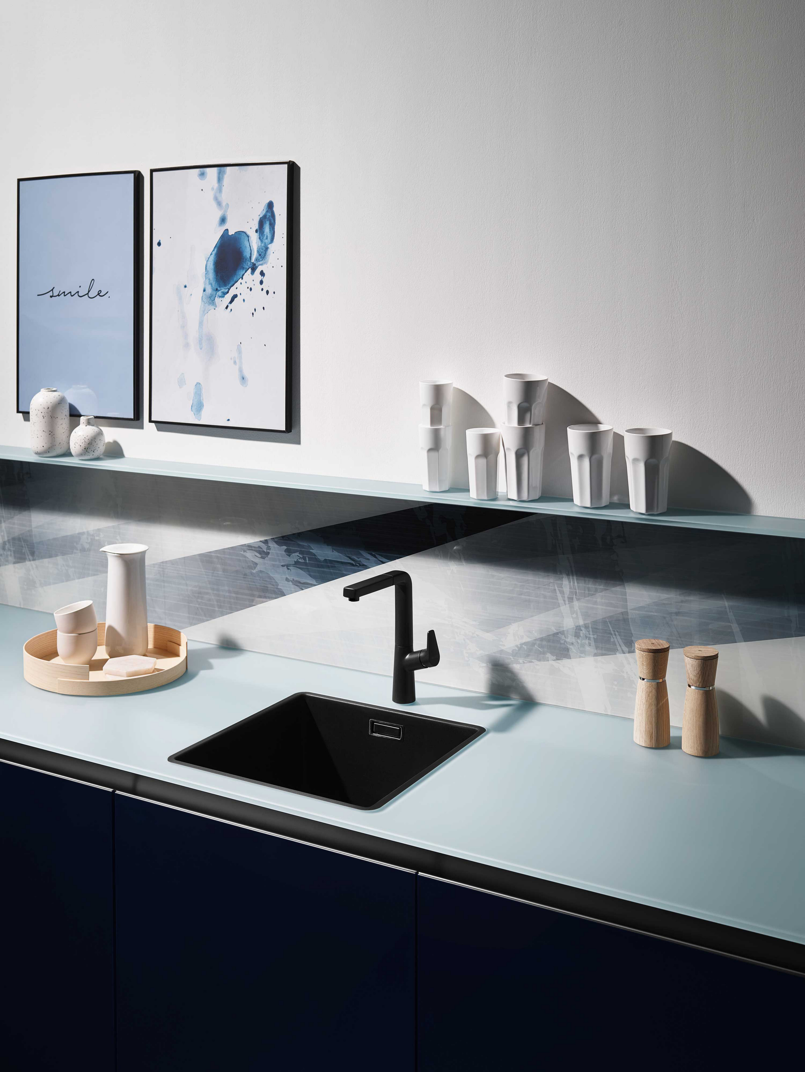 Whether it's a magnetic board, a simple niche backsplash or a glass worktop, a subtle shade of blue is versatile.
